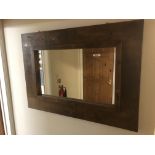 A rustic wall mirror. Note: VAT is payable on the hammer price of this lot at 20%.