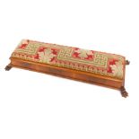 A 20thC fireside stool, the rectangular tapestry top, raised on a moulded base on claw feet, 18cm hi