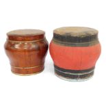 Two Chinese food storage containers, one with brass banding and the other painted in red and black,