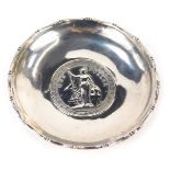 A white metal coin pin dish, centred with a 1911 one dollar coin, white metal border stamped silver,