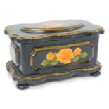A 19thC lacquer jewellery box, with a fluted border and central oval orange rose with butterfly, on