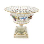 A 20thC Dresden porcelain pedestal fruit bowl, the pierced bowl decorated with painted and applied f