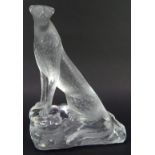 A Lalique glass sculpture, modelled as a cheetah on a rock work base, signed Lalique France, 25cm hi