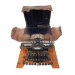 A Blickensderfer American number 5 typewriter, supplied by Taylor's Ltd, in leather case, name plate