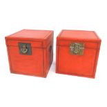 Two painted storage boxes, in red, brass clasps, 40cm high. (AF)