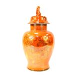 A Carltonware orange lustre jar and cover, of large proportion with dog of fo handle and hand painte