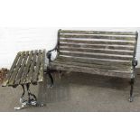 A Victorian style garden two seater bench, with slatted supports, 89cm high, 127cm wide, 50cm deep,