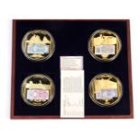 Four commemorative proof coins from the British Military Money series, in fitted case.