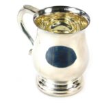 A George VI silver tankard, of plain design with fluted handle on a stepped base, maker PB, Sheffiel