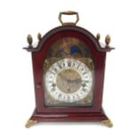 A 20thC mahogany cased mantel clock, the brass dial with silvered Roman numeric chapter ring marked