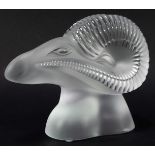 A Lalique glass paperweight, modelled as a stylised ram's head, signed Lalique France, 17cm high.