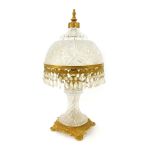 A 20thC cut glass and gilt metal mounted table lamp, the shade with faceted hob nail cut decoration,