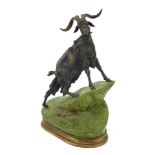 After J Moigniez. A cast metal figure group of a mountain goat, on green mount, signed, 28cm high.