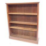 A 20thC oak open bookcase, the top with a moulded edge enclosing four shelves, on a plinth base, 136