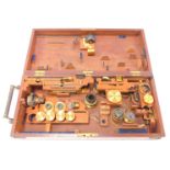 Microscope optics and lenses in mahogany box, to include lenses for Smith & Beck of London and other
