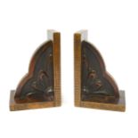 A pair of oak bookends, 21cm high.