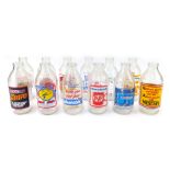 A group of glass advertising bottles, comprising 'smashing value from your milkman', Weetabix, Ready