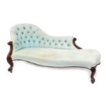 A 19thC show frame chaise longue, the button back upholstered in pale blue fabric with scrolling arm