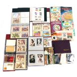 Various Post Office issued postcards, a album containing postcards 1940/50's film stars, GB stamps,