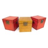 Three painted wooden boxes, two in red and one in yellow, with ornate clasp, each 39cm high. (AF) (3