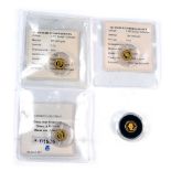 Four Elizabeth II miniature gold coins, each weighing 0.5g.