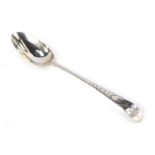 A Victorian silver fiddle pattern serving spoon, with engraved floral detail, bearing initials MD, D