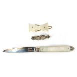 A silver swallow brooch, silver and mother of pearl handled penknife, and a mother of pearl bow broo