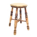 An elm stool, with solid seat, raised on four turned legs, united by an X shaped stretcher, 48cm hig
