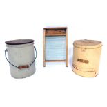 An Acme washboard and two vintage bread bins, 34cm high. (3) We have instructions from the vendor to