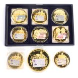 Nine gold plated proof coins from the British Banknotes Collection.