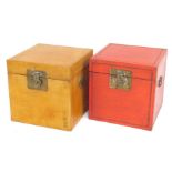 Two painted storage boxes, in yellow and red, brass clasps, 40cm high. (AF)