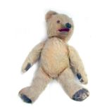 A 1950s mohair Teddy Bear, with felt pads and opposable arms and legs, 30cm high.