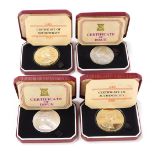 Four silver proof commemorative coins, comprising two Elizabeth II Silver Jubilee crowns, and two 19