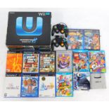 A Nintendo Wii U console, together with two gamecube controllers, various Wii U games, Playstation 2