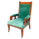 An Edwardian mahogany open armchair, with turquoise velvet over stuffed seat, back and arms, on fron