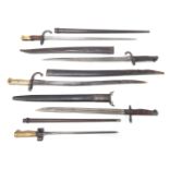 A group of five bayonets, comprising a 1907 MKI, a Brasilian Mauser, a Turkish Mauser, an EFD, and a