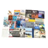 A group of aviation related items, to include a brass model of a spitfire, 19cm wide, together with