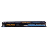 A Star Wars Force FX lightsaber, in blue, boxed.