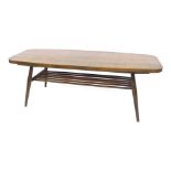 An Ercol dark elm coffee table, the rectangular top with a curved edge, above a slatted under tier,