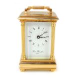 A 20thC brass cased carriage clock, with white enamel Roman numeric dial marked Robert Blandford 187