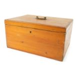 A 20thC pine storage box, with brass swing handle, lacking interior, 16cm high, 31cm wide, 22cm deep