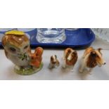 A Beatrix Potter figure modelled ad Old Mr Brown, together with three pottery dog figures.