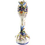 A late 19th/early 20thC Rouen French faience fluted stem vase, the shaped and scroll top polychrome