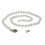 A cultured pearl single strand necklace, with an oval 9ct gold clasp, set with tiny diamonds, on kno
