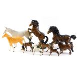 A collection of Beswick and other horses, comprising a Beswick rearing horse on green base, 28cm hig