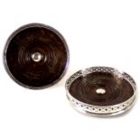 A pair of George V silver wine coasters, each with a thin pierced rim and rope twist border, maker s
