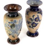 Two similar Royal Doulton stoneware vases, each decorated with flowers and leaves, within tube lined