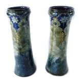 A pair of Royal Doulton Lambeth vases, in the Art Nouveau style on a green and blue mottled glaze, w