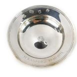 An Elizabeth II silver pin dish, with central crest bearing the initials TFS, inscribed H Radford 19