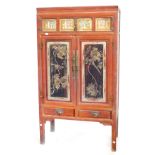 A Chinese painted cabinet, the top with two frieze doors, each inset with gilt lacquered panels, abo